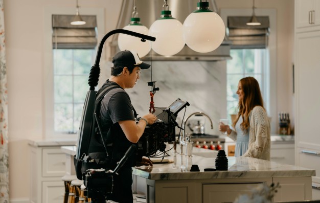 Man With a Cinema Camera Filming an Actress