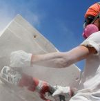 Man cutting stone