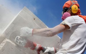 Man cutting stone