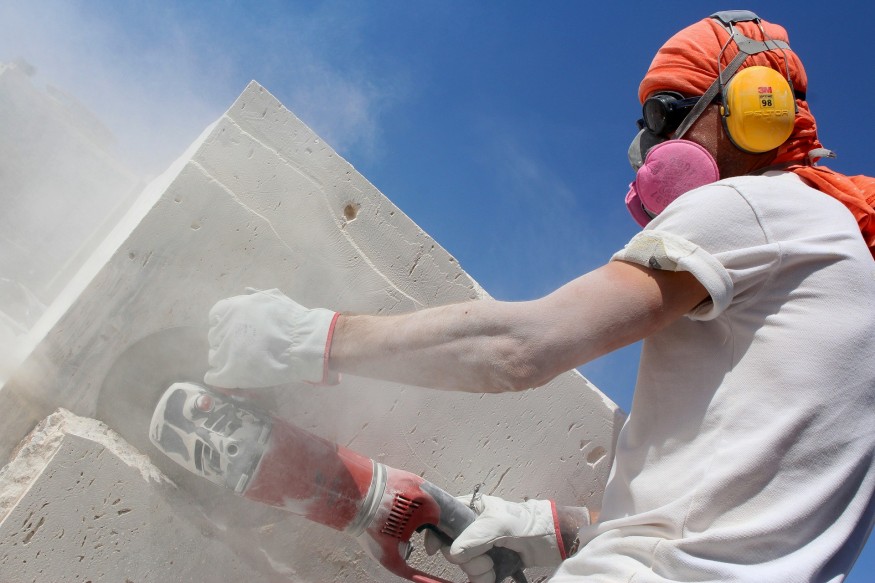 Man cutting stone